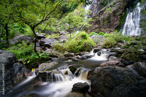 Waterfall in autumn forest at Erawan National Park, Thailand.Exotic waterfall and lake panorama landscape of Thailand.