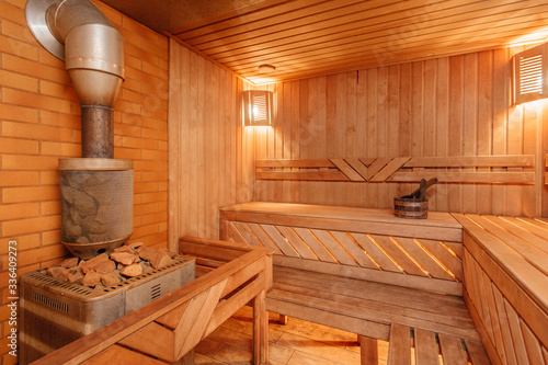 sauna bathhouse warm interior inside empty brooms barrels bucket for water