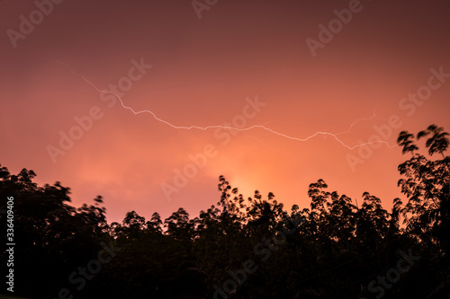 Lightning flash over the sunset sky