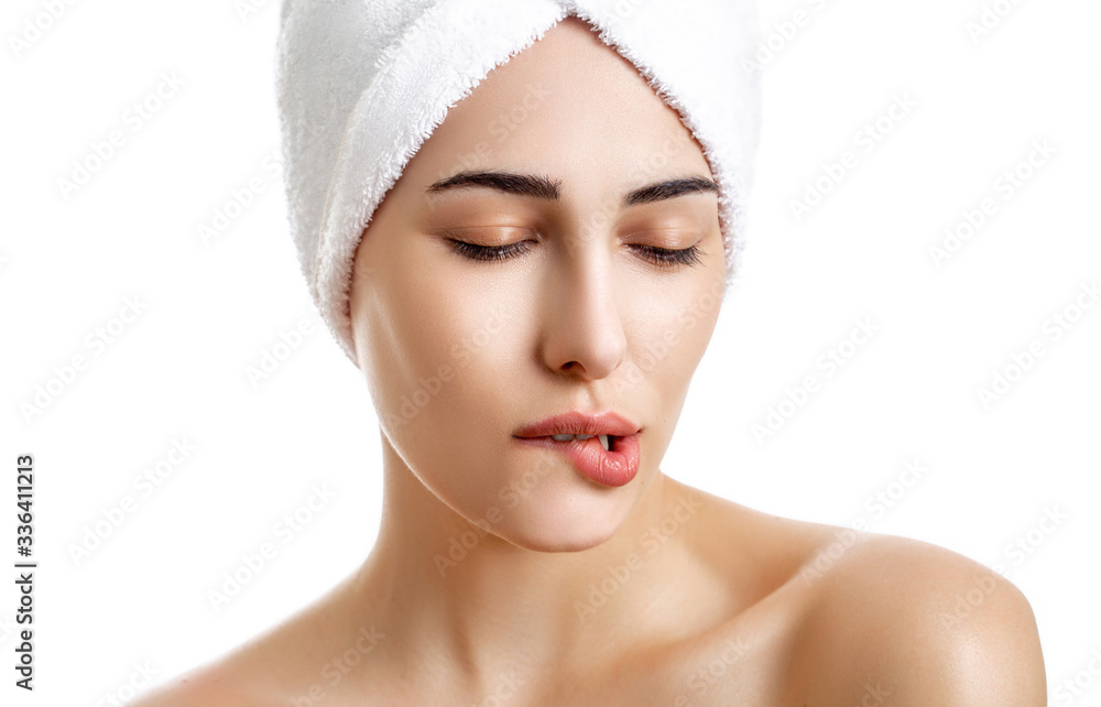 Girl with towel on head on white background,with clear skin Girl with towel on head on white background,with clear skin