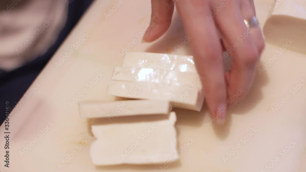 chef dices mozzarella for italian pizza
chef dices mozzarella for italian pizza