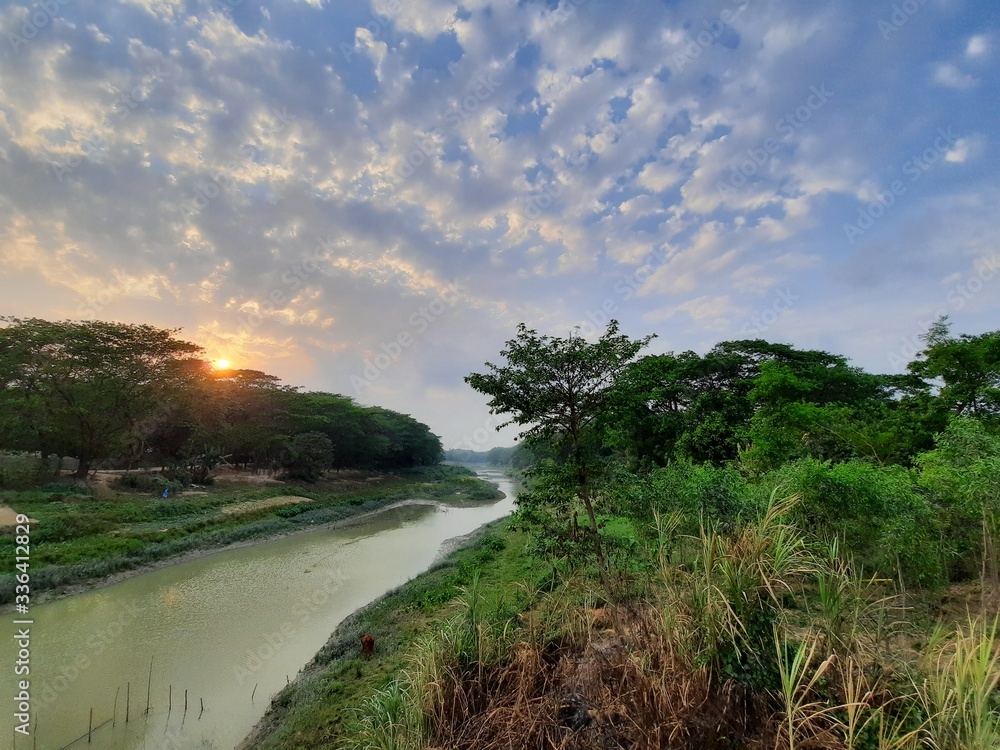 Obraz premium sunset over the river