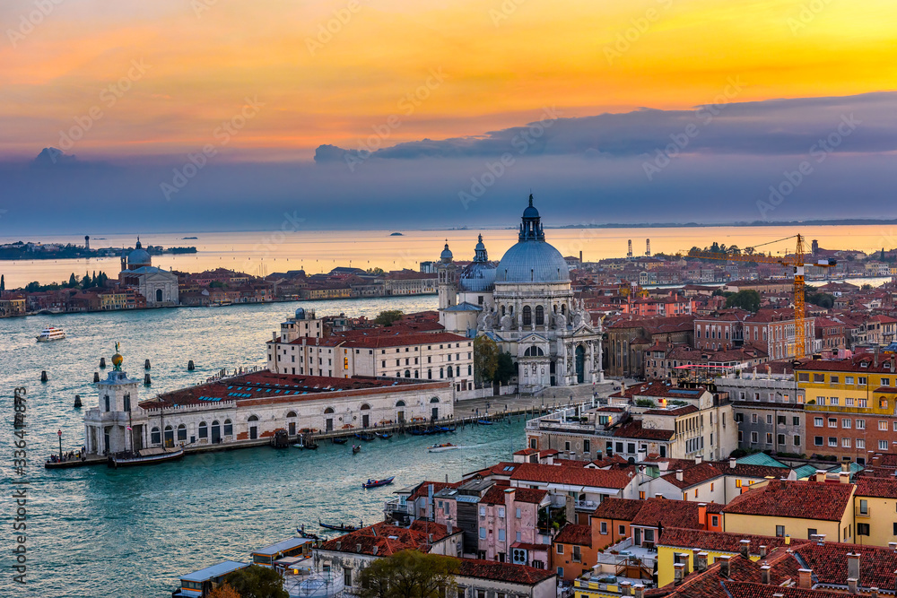 Fototapeta premium Aerial sunset view of Venice, Grand Canal and Basilica di Santa Maria della Salute in Venice, Italy. Architecture and landmarks of Venice. Venice postcard