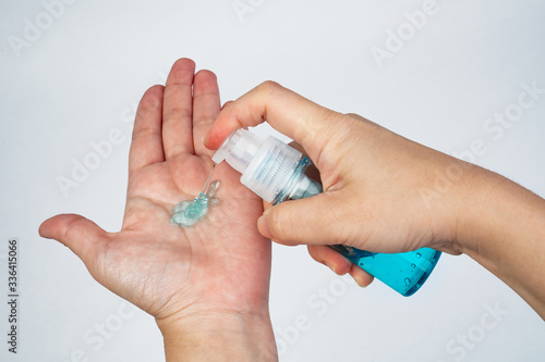 hand holding a alcohol gel bottle