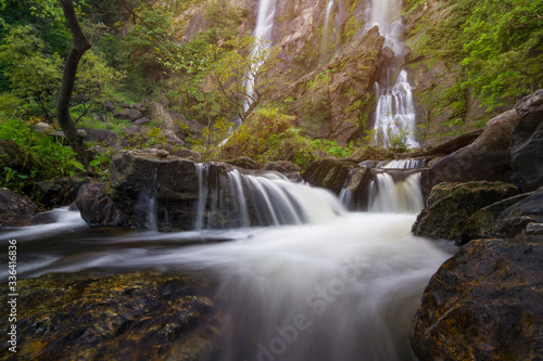 Beautiful waterfall in autumn forest, KampengPhet, Khlong Lan waterfall in autumn forest,