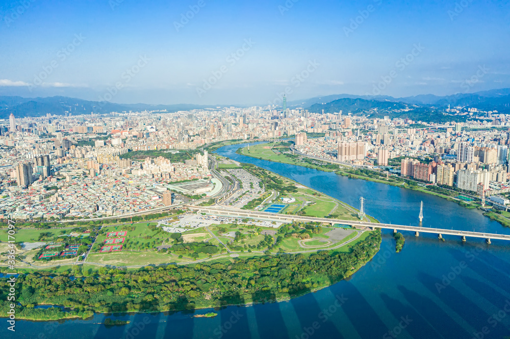 Fototapeta premium Taipei City Aerial View - Asia business concept image, panoramic modern cityscape building bird’s eye view under daytime and blue sky, shot in Taipei, Taiwan.