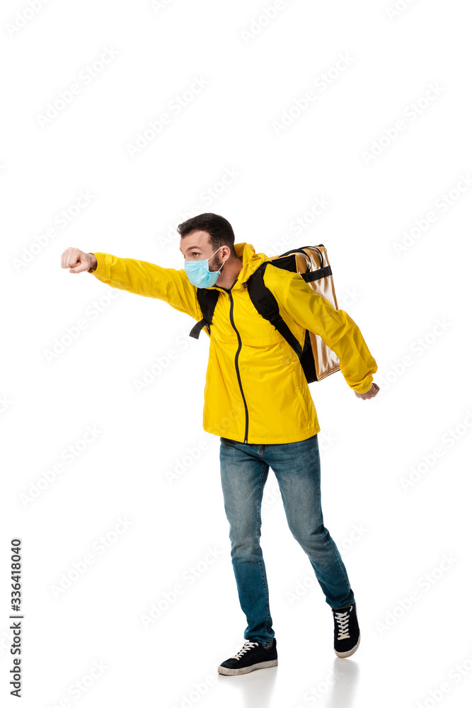 delivery man in medical mask and backpack with order gesturing on white delivery man in medical mask and backpack with order gesturing on white