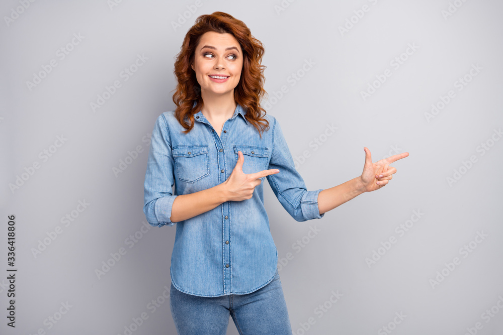 Portrait of positive cool pretty woman promoter point index finger copyspace indicate adverts promotion demonstrate suggest select wear modern outfit isolated over grey color background Portrait of positive cool pretty woman promoter point index finger copyspace indicate adverts promotion demonstrate suggest select wear modern outfit isolated over grey color background