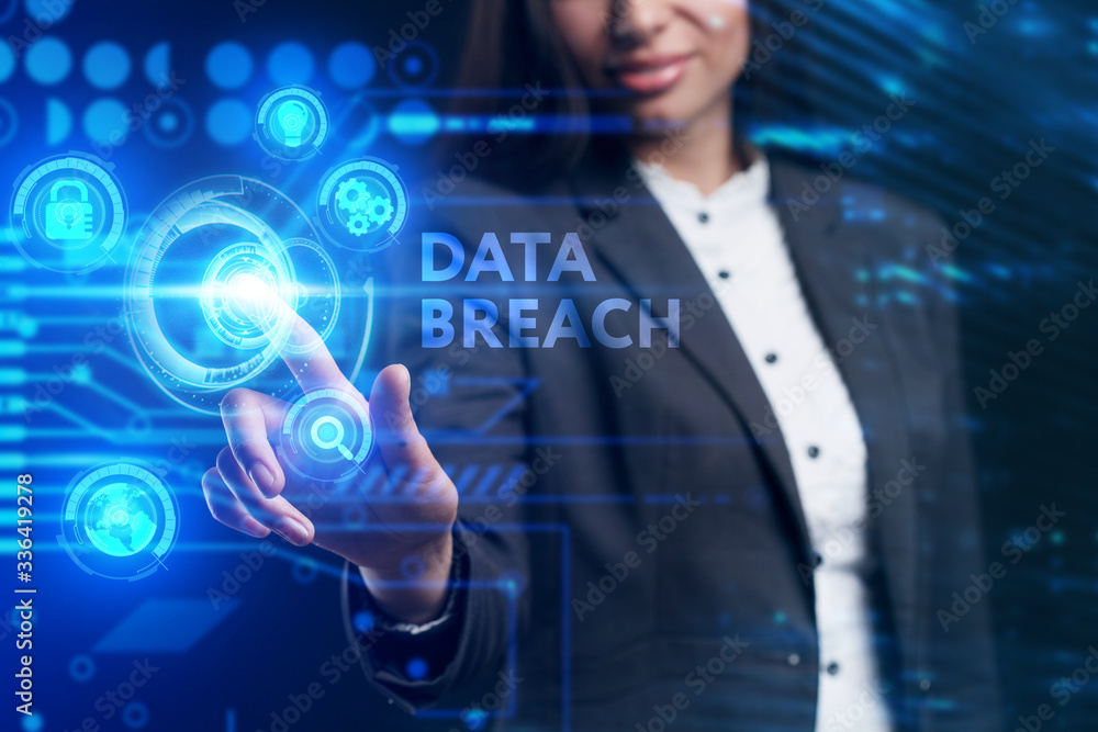 Fototapeta premium Business, Technology, Internet and network concept. Young businessman working on a virtual screen of the future and sees the inscription: Data breach