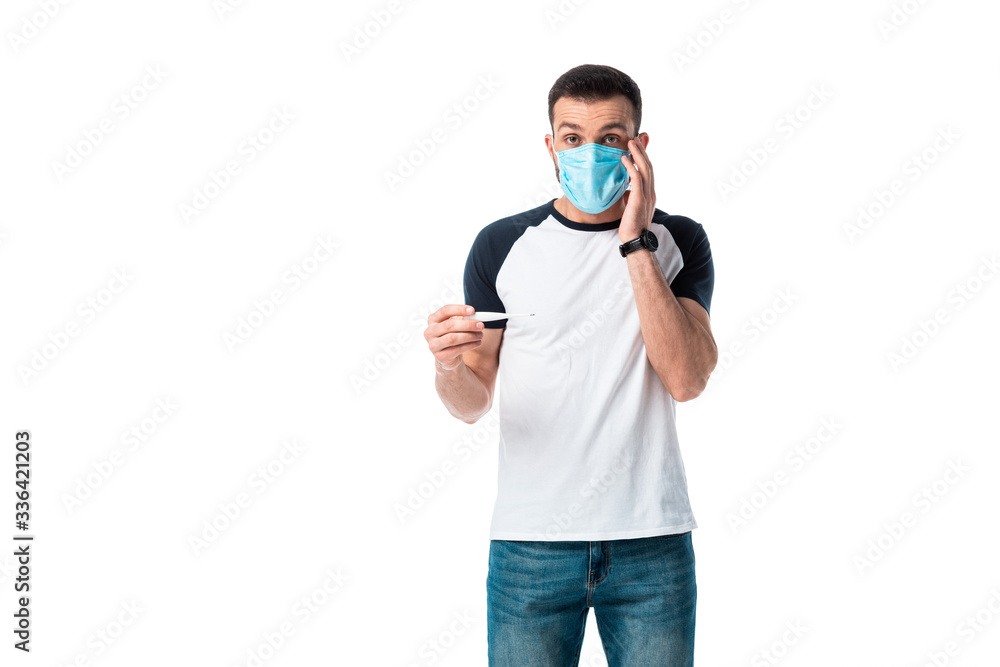 diseased man in medical mask holding digital thermometer isolated on white diseased man in medical mask holding digital thermometer isolated on white