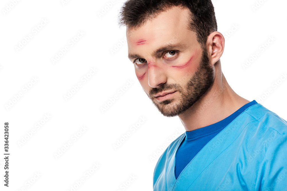 bearded doctor with marks on face looking at camera isolated on white bearded doctor with marks on face looking at camera isolated on white