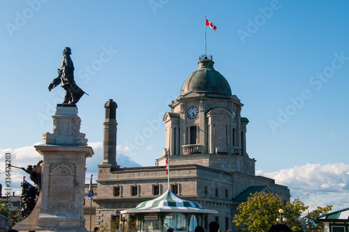 The old post office with its clock tower and monument to Samuel de Champlain, founder of Quebec City by Paul Chevré in 1898. photo