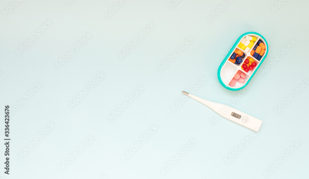 Dose pill box with medical pills. Top view. Flat lay. Copy space. Pharmaceutical medicine pills, tablets and capsules. Medicine concepts. Dose pill box with medical pills. Top view. Flat lay. Copy space. Pharmaceutical medicine pills, tablets and capsules. Medicine concepts.