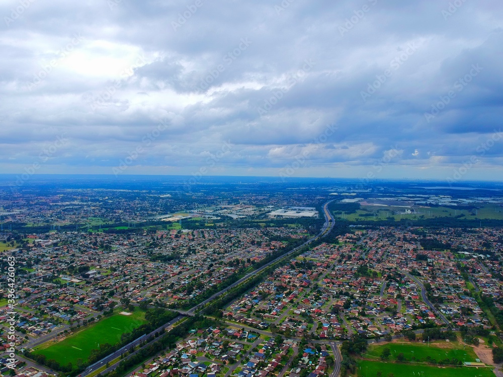 Fototapeta premium Above St Clair Drone panorama aerial view of Sydney NSW Australia city Skyline and looking down on all suburbs