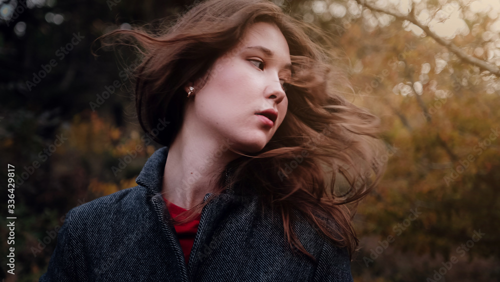Beautiful Asian woman in a golden autumn forest. Beautiful Asian woman in a golden autumn forest.