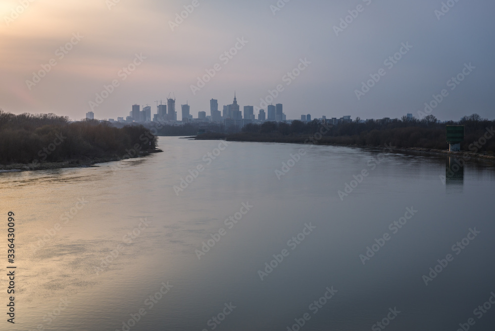 Fototapeta premium River Vistula and evening distance view of downtown in Warsaw, Poland