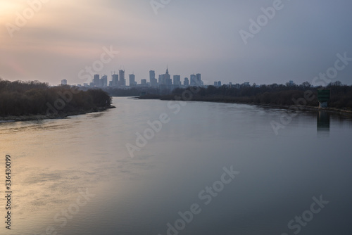 River Vistula and evening distance view of downtown in Warsaw, Poland