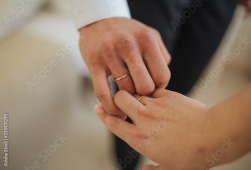hands of the groom and bride