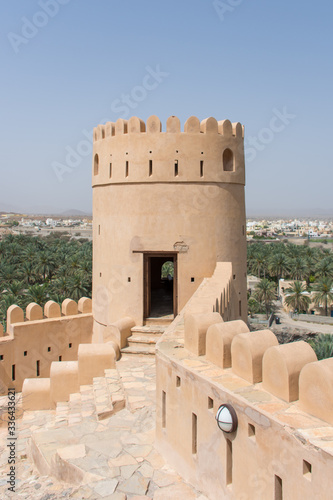 Ancient Omani fortress watchtower and desert view in the mountains with a fantastic view across the plains to spot unsuspecting visitors.