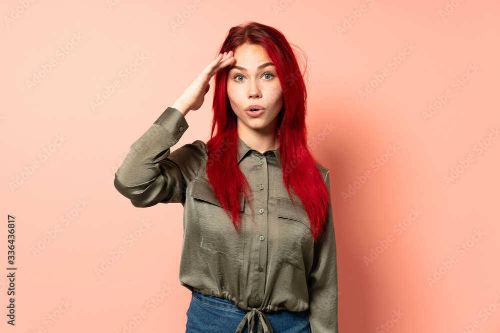 Teenager red hair girl isolated on pink background has realized something and intending the solution Teenager red hair girl isolated on pink background has realized something and intending the solution