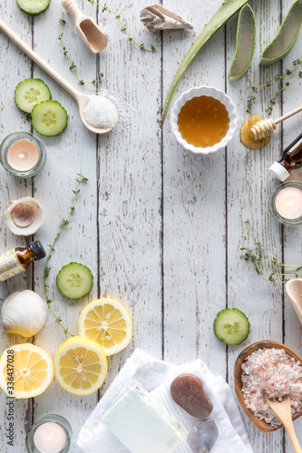 A top down border arrangement of various natural remedies used in alternative beauty and wellness therapy treatments. photo