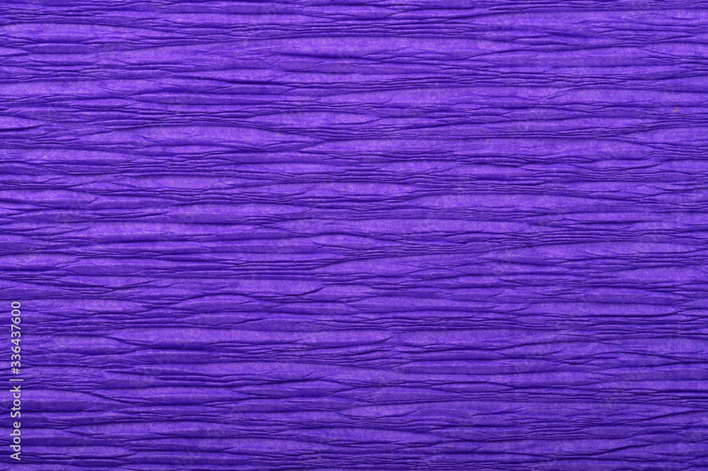 Background of purple pressed corrugated paper with a horizontal texture taken close up Background of purple pressed corrugated paper with a horizontal texture taken close up