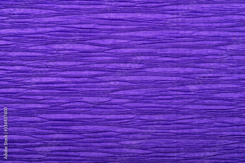 Background of purple pressed corrugated paper with a horizontal texture taken close up