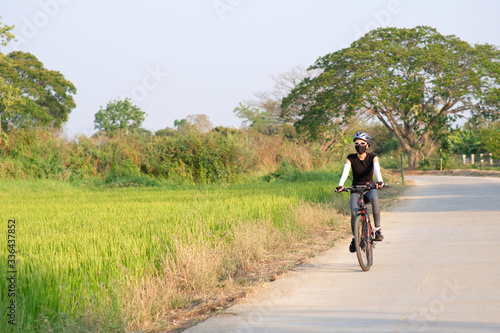 sporty woman riding a mountain bike in the natural background