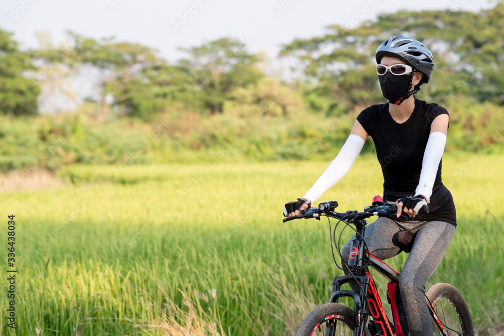 sporty woman riding a mountain bike in the natural background sporty woman riding a mountain bike in the natural background