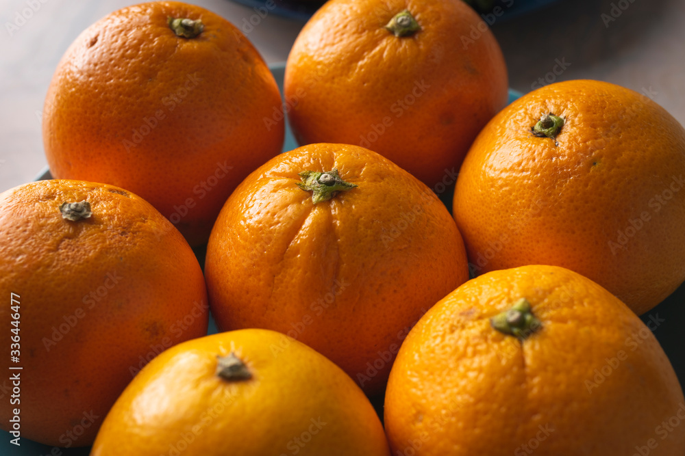 Fruit plate with oranges on a dining table for healthy dish Fruit plate with oranges on a dining table for healthy dish