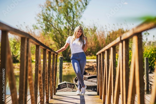 young woman standing on a bridge © cesc92