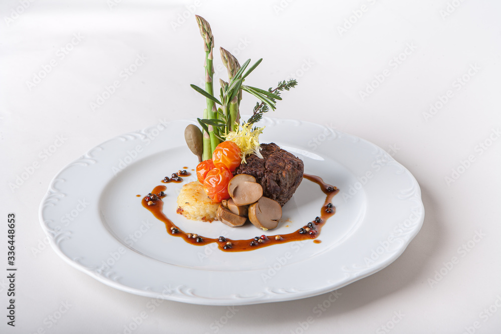 Steak with mashed potatoes and asparagus. Mushrooms, tomatoes, sauce, capers. Steak with mashed potatoes and asparagus. Mushrooms, tomatoes, sauce, capers.
