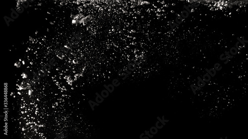 Blurry images of real soda bubbles floating and splashing up in black background which represent freshness of carbornate drink or sparkling water and shoot from realistic water moving not 3D making