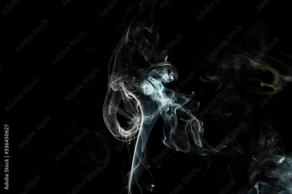 puffs of white smoke with a black background puffs of white smoke with a black background