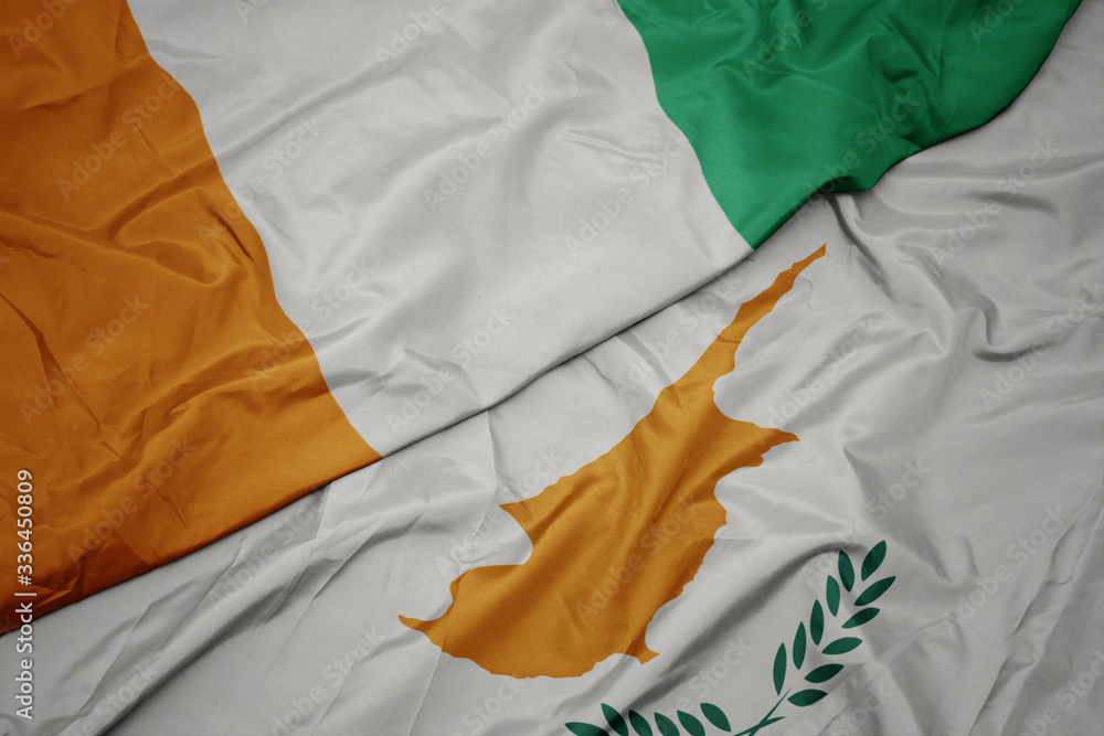 waving colorful flag of cyprus and national flag of cote divoire.