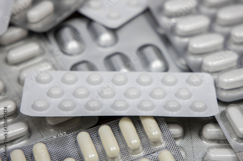 Different medicines: tablets, pills in blister pack, medications drugs, macro, selective focus