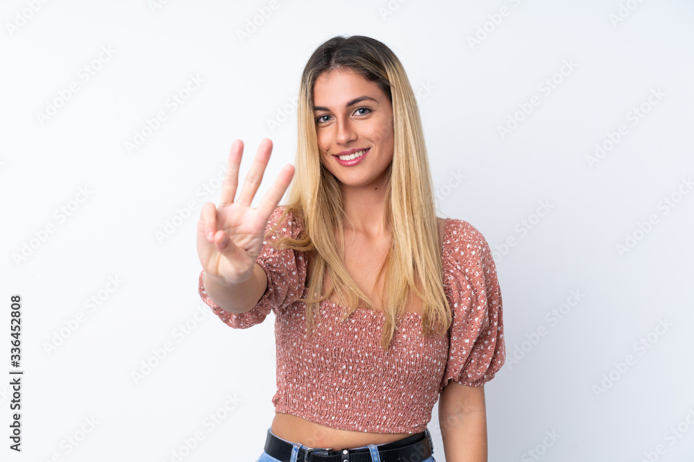 Young Uruguayan woman over isolated white background happy and counting three with fingers Young Uruguayan woman over isolated white background happy and counting three with fingers