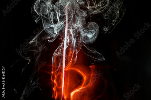 puffs of white and red smoke with a black background