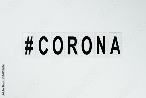 black hashtag corona in the middle on white background
