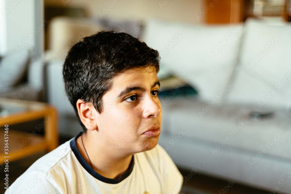 Head shot of young boy concentrating on playing video games Head shot of young boy concentrating on playing video games