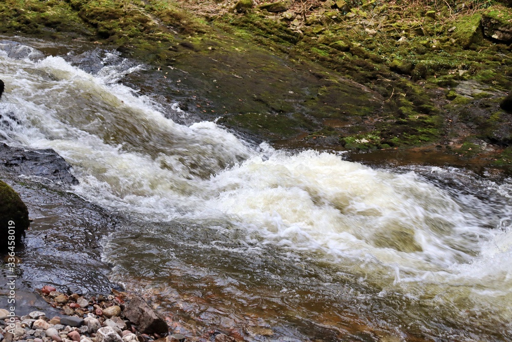 Water flowing over rocks Water flowing over rocks