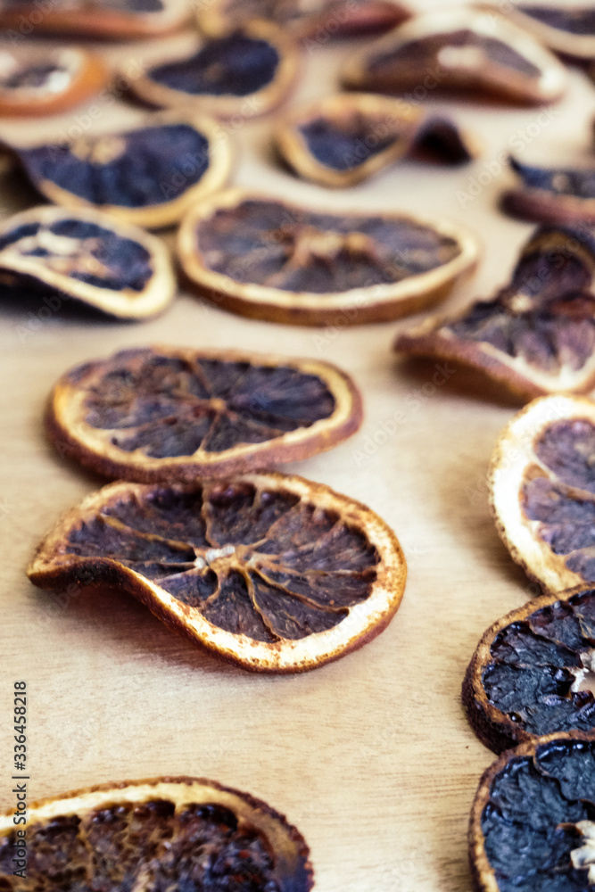 Fototapeta premium Dried oranges on the brown background