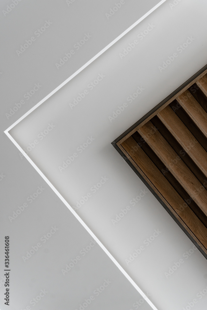 Obraz premium creative ceiling with wood paneling,modern wooden suspended ceiling,black loft lights in the ceiling,energy saving light bulbs