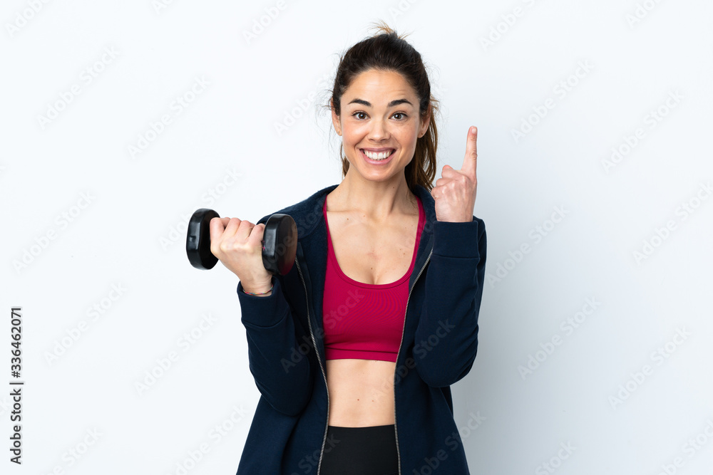 Sport woman making weightlifting over isolated white background pointing up a great idea Sport woman making weightlifting over isolated white background pointing up a great idea