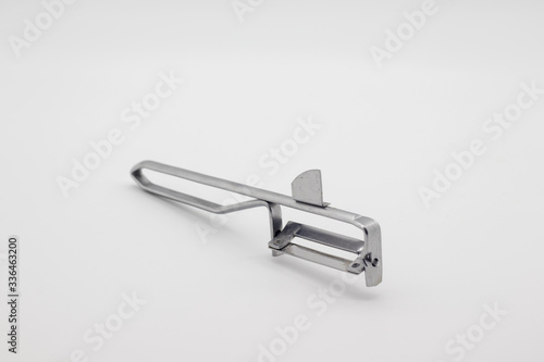Metal peeler for vegetables and fruits.