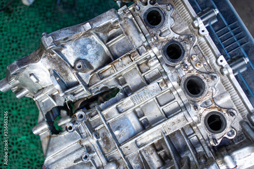 Broken engine. Hole in the cylinder block