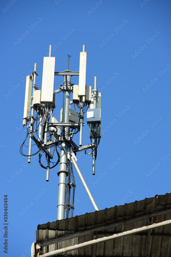 Telecommunication tower with antennas.High pole for signal transmission. There are both wireless phone systems and microwave systems.	