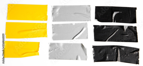 Set of yellow, gray, black tapes on white background. Torn horizontal and different size sticky tape, adhesive pieces.