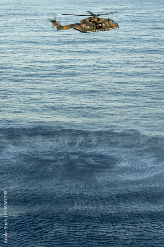helicopter hovering over the pacific