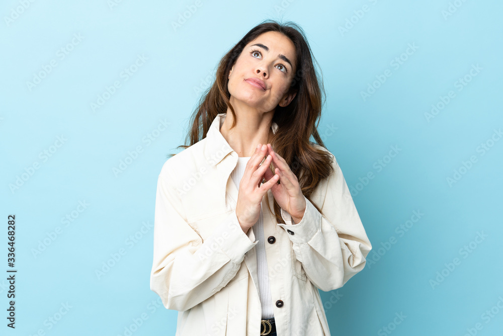 Woman over isolated background scheming something Woman over isolated background scheming something